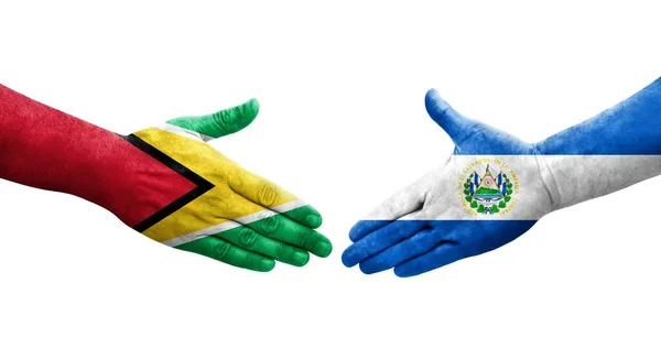 Händedruck Zwischen Flaggen Salvadors Und Guyanas Auf Hände Gemalt Isoliertes — Stockfoto