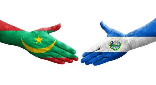 stock image Handshake between El Salvador and Mauritania flags painted on hands, isolated transparent image.