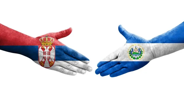 Handdruk Tussen Salvador Servië Vlaggen Geschilderd Handen Geïsoleerd Transparant Beeld — Stockfoto