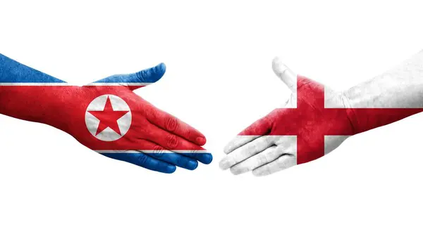 Aperto Mão Entre Inglaterra Coreia Norte Bandeiras Pintadas Mãos Imagem — Fotografia de Stock