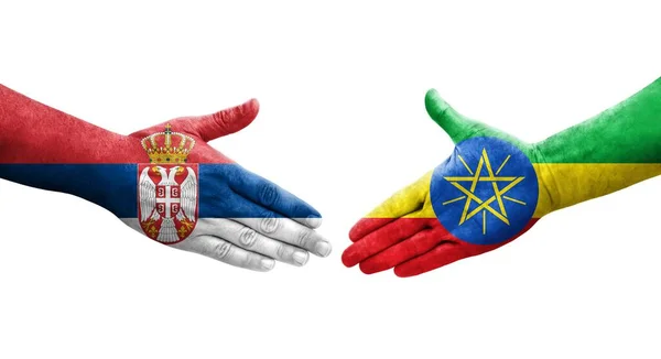 Stretta Mano Tra Etiopia Serbia Bandiere Dipinte Mani Immagine Isolata — Foto Stock