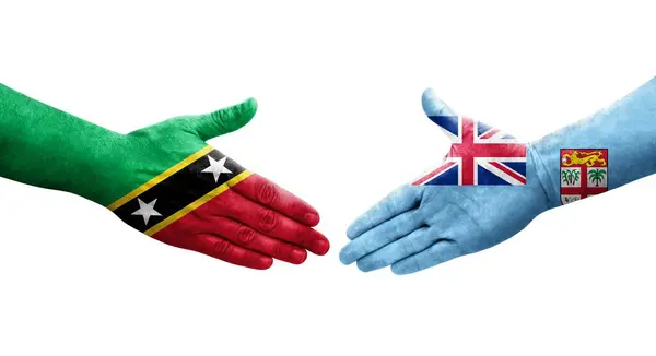 Handdruk Tussen Fiji Saint Kitts Nevis Vlaggen Geschilderd Handen Geïsoleerde — Stockfoto