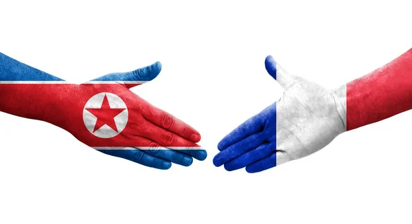 Händedruck Zwischen Frankreich Und Nordkorea Fahnen Auf Händen Gemalt Isoliertes — Stockfoto