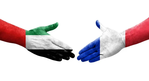 手に描かれたフランスとUaeの旗の間の握手 隔離された透明画像 — ストック写真