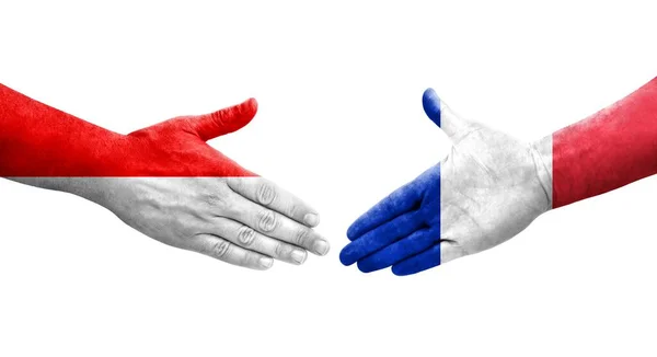 Apretón Manos Entre Las Banderas Francia Indonesia Pintadas Las Manos — Foto de Stock