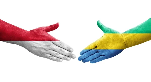 加蓬和摩纳哥之间的握手手绘国旗 孤立透明的形象 — 图库照片