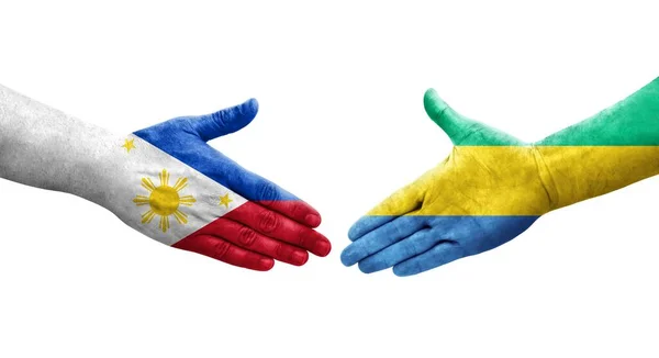 Uścisk Dłoni Między Flagami Gabonu Filipin Namalowanymi Dłoniach Odizolowany Przezroczysty — Zdjęcie stockowe