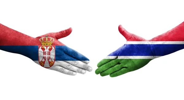 Handslag Mellan Gambia Och Serbien Flaggor Målade Händer Isolerad Transparent — Stockfoto