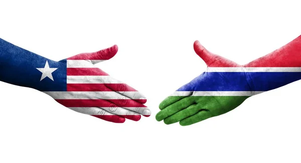 Händedruck Zwischen Gambia Und Liberia Flaggen Auf Hände Gemalt Isoliertes — Stockfoto