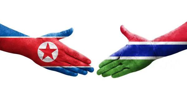 Apretón Manos Entre Gambia Corea Del Norte Banderas Pintadas Las —  Fotos de Stock