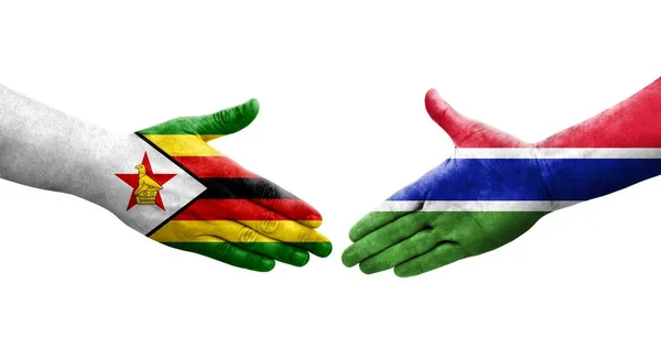 Apretón Manos Entre Gambia Zimbabwe Banderas Pintadas Las Manos Imagen —  Fotos de Stock
