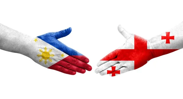 Uścisk Dłoni Między Gruzją Filipinami Flagi Malowane Rękach Odizolowany Przezroczysty — Zdjęcie stockowe