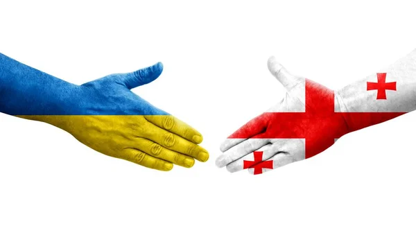 stock image Handshake between Georgia and Ukraine flags painted on hands, isolated transparent image.