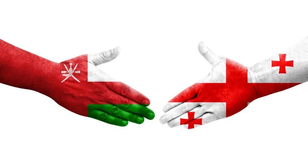 Handslag Mellan Georgien Och Oman Flaggor Målade Händer Isolerad Transparent — Stockfoto