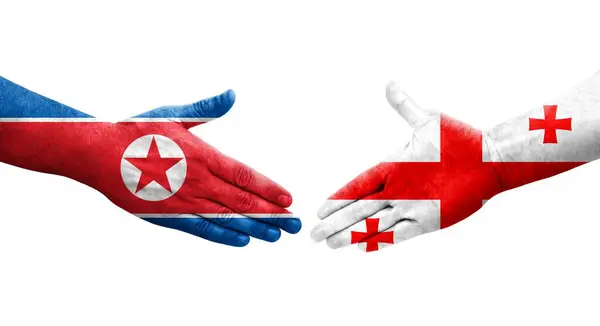 Aperto Mão Entre Geórgia Coreia Norte Bandeiras Pintadas Mãos Imagem — Fotografia de Stock