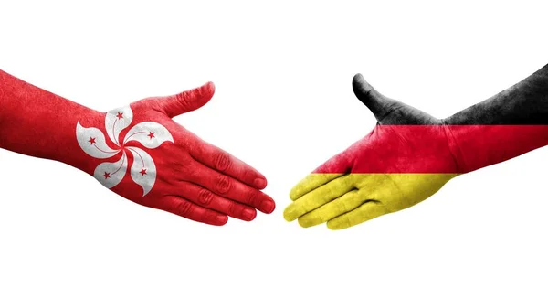 手に描かれたドイツと香港の旗の間の握手 孤立した透明なイメージ — ストック写真