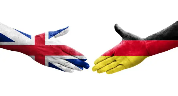 stock image Handshake between Germany and Great Britain flags painted on hands, isolated transparent image.