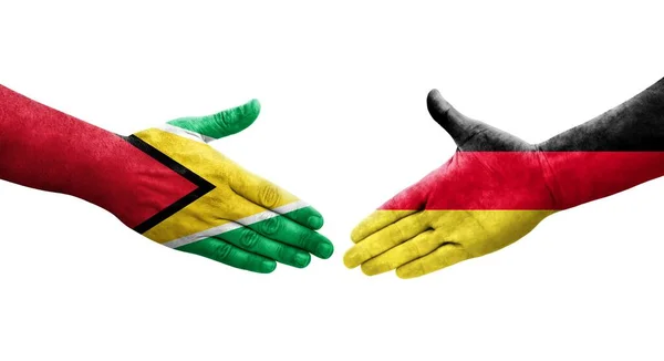 Stretta Mano Tra Germania Guyana Bandiere Dipinte Mani Isolata Immagine — Foto Stock