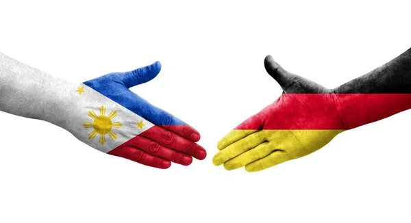 Handslag Mellan Tyskland Och Filippinerna Flaggor Målade Händer Isolerad Transparent — Stockfoto