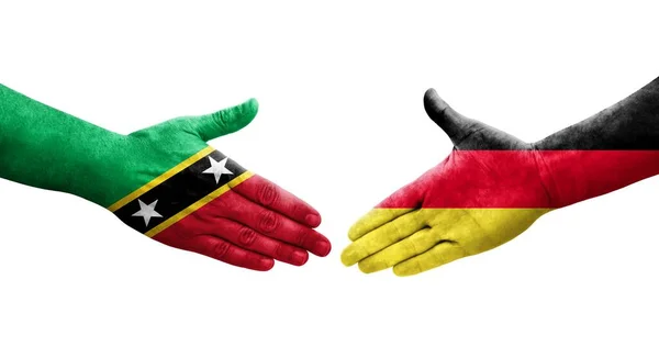 Uścisk Dłoni Między Niemcami Saint Kitts Flagami Nevis Namalowanymi Dłoniach — Zdjęcie stockowe