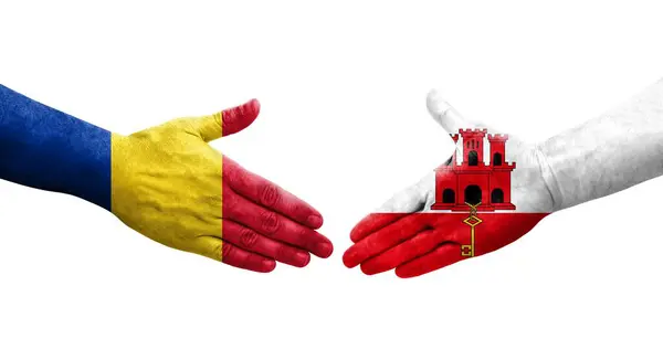 stock image Handshake between Ghana and Romania flags painted on hands, isolated transparent image.