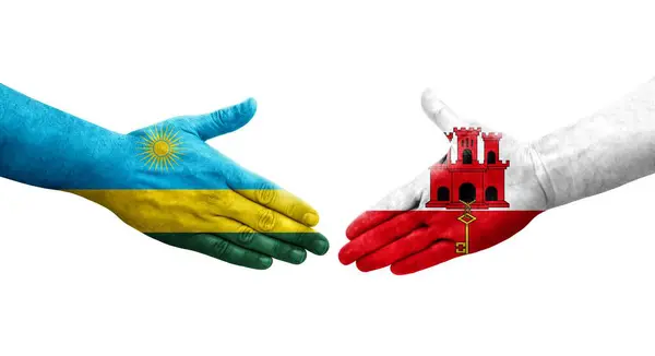 stock image Handshake between Ghana and Rwanda flags painted on hands, isolated transparent image.