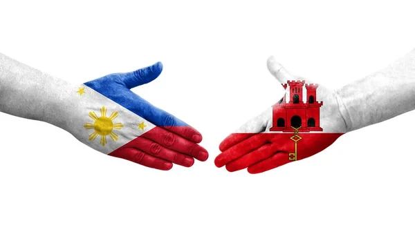 ジブラルタルとフィリピンの旗の間の握手手で描かれた孤立した透明なイメージ — ストック写真