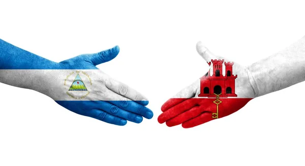 Mano Apretada Entre Gibraltar Nicaragua Banderas Pintadas Las Manos Imagen — Foto de Stock