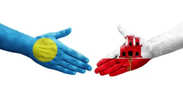 手描きのジブラルタルとパラオの旗の間の握手 孤立した透明なイメージ — ストック写真