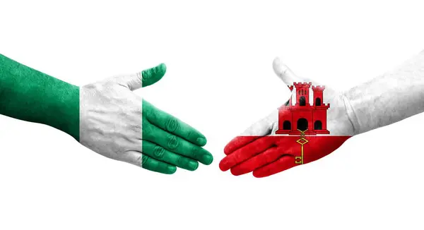 Рукостискання Між Гібралтаром Нігерійським Прапором Намальоване Руках Ізольоване Прозоре Зображення — стокове фото