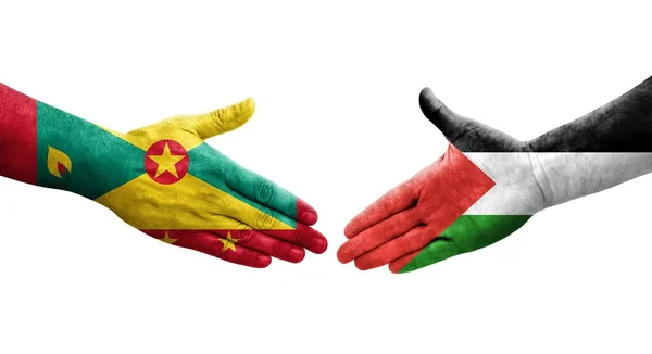 stock image Handshake between Grenada and Palestine flags painted on hands, isolated transparent image.