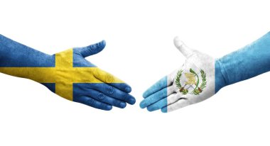 Guatemala ve İsveç bayrakları arasındaki el sıkışma, izole şeffaf görüntü.