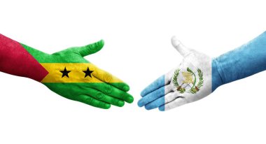 Guatemala ve Sao Tome ve Principe bayrakları arasındaki tokalaşma elleri boyalı, izole şeffaf görüntü.