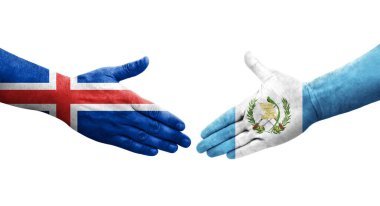 Guatemala ve İzlanda bayrakları arasında el sıkışma, izole şeffaf görüntü.