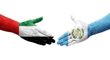 Guatemala ve BAE bayrakları arasında el sıkışma, izole şeffaf görüntü.