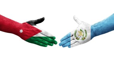 Guatemala ve Ürdün bayrakları arasındaki el sıkışma ellerinde izole şeffaf görüntü.