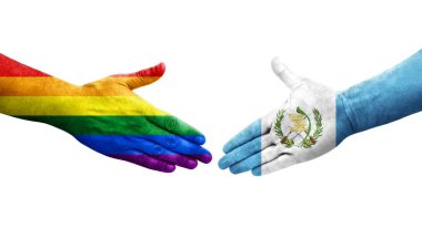 Guatemala ve LGBT bayrakları arasında el sıkışma, izole şeffaf resim.