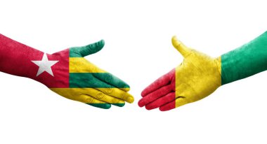 Ellerinde Gine ve Togo bayrakları arasında el sıkışma, izole şeffaf görüntü.