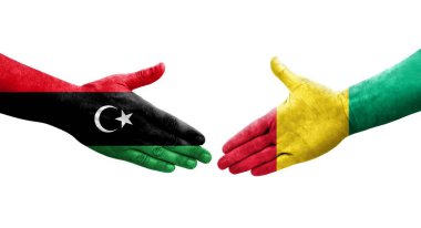 Ellerinde Gine ve Libya bayrakları arasında el sıkışma, izole saydam görüntü.