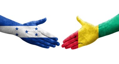 Gine ve Honduras bayrakları arasında el sıkışma, izole şeffaf görüntü.