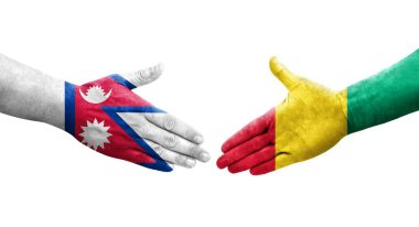 Ellerinde Gine ve Nepal bayrakları arasında el sıkışma, izole şeffaf görüntü.