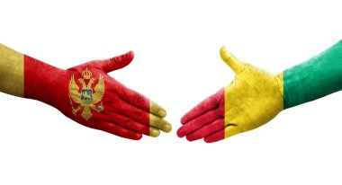 Gine ve Karadağ bayrakları arasındaki el sıkışma, izole edilmiş şeffaf görüntü.