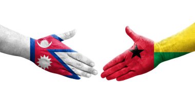 Ellerinde Gine Bissau ve Nepal bayrakları arasında el sıkışma, izole saydam görüntü.