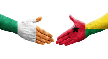 Gine Bissau ve İrlanda bayrakları arasındaki el sıkışma, izole şeffaf görüntü.