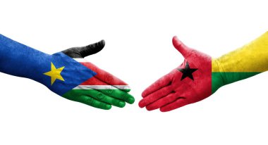 Gine Bissau ve Güney Sudan bayrakları arasındaki el sıkışma, izole şeffaf görüntü.