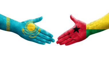 Gine Bissau ve Kazakistan bayrakları arasındaki el sıkışma, izole şeffaf görüntü.