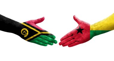 Ellerinde Gine Bissau ve Vanuatu bayrakları arasında el sıkışma, izole şeffaf görüntü.