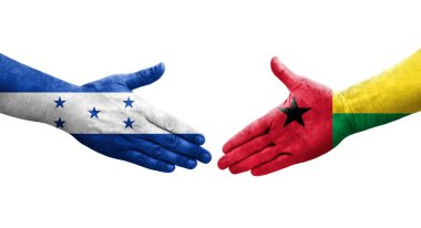 Gine Bissau ve Honduras bayrakları arasındaki el sıkışma, izole şeffaf görüntü.