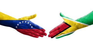 Guyana ve Venezuela bayrakları arasındaki tokalaşma elleri boyalı, izole şeffaf görüntü.