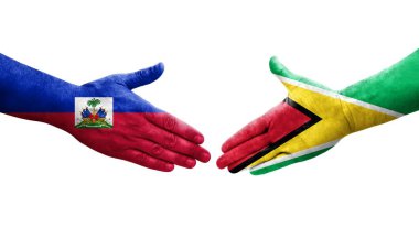 Guyana ve Haiti bayrakları arasındaki el sıkışma, izole şeffaf görüntü.